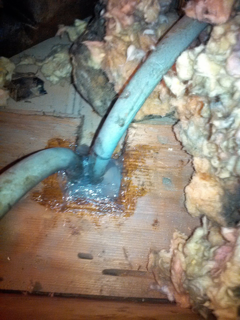 Gap around electrical conduit pipe is caulked